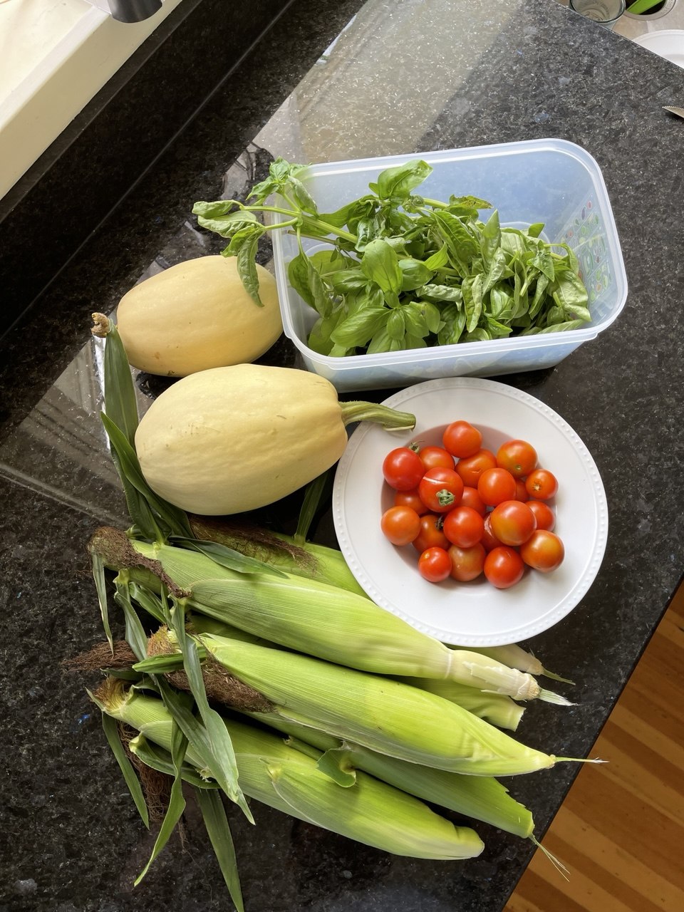 Spaghetti squash, sweet corn, cherry tomatoes, and fresh basil from the garden